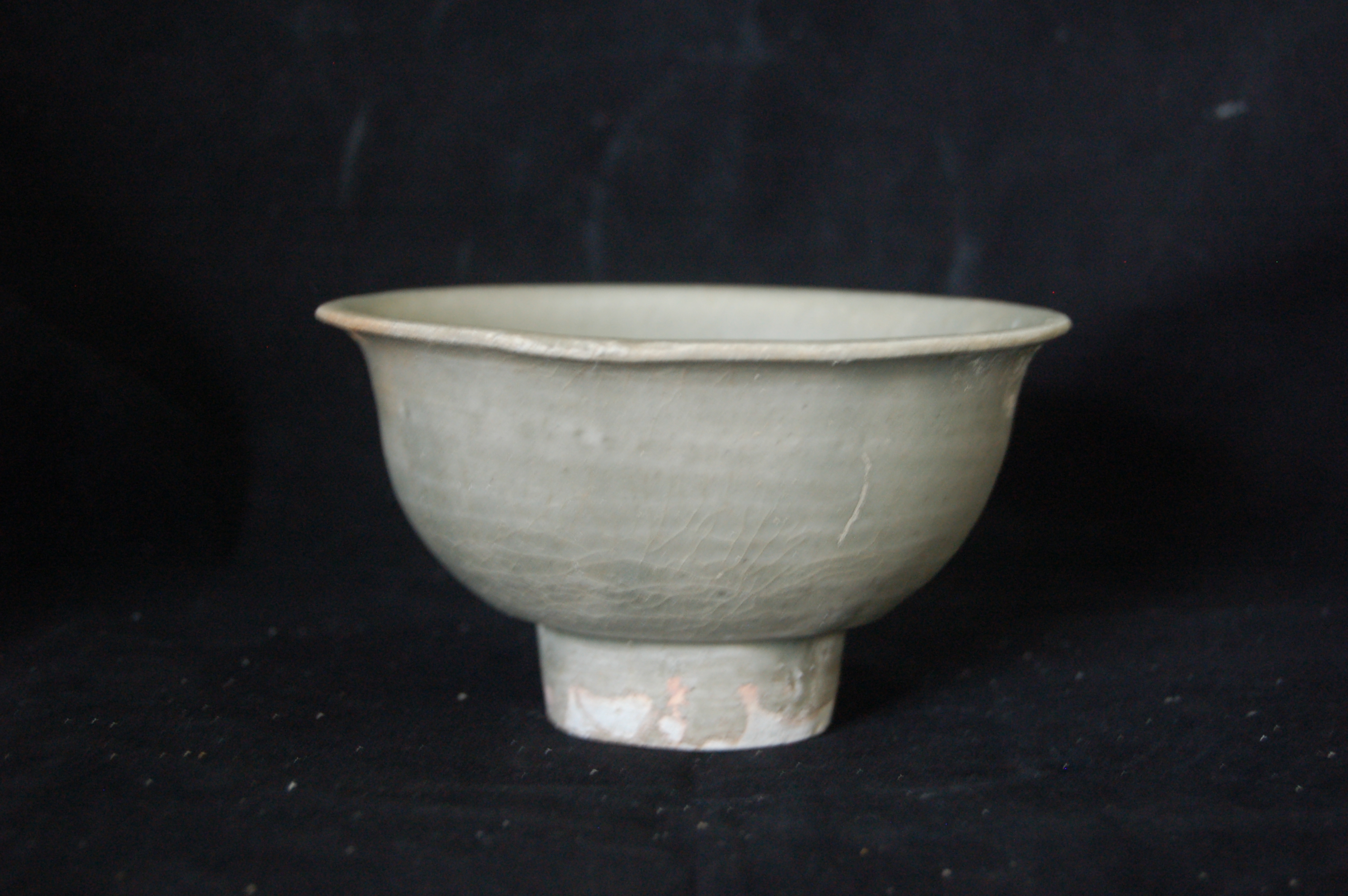 Small bowl with everted rim, rounded wall and high carved foot-ring. Diameter 12 cm, height 6.5 cm.