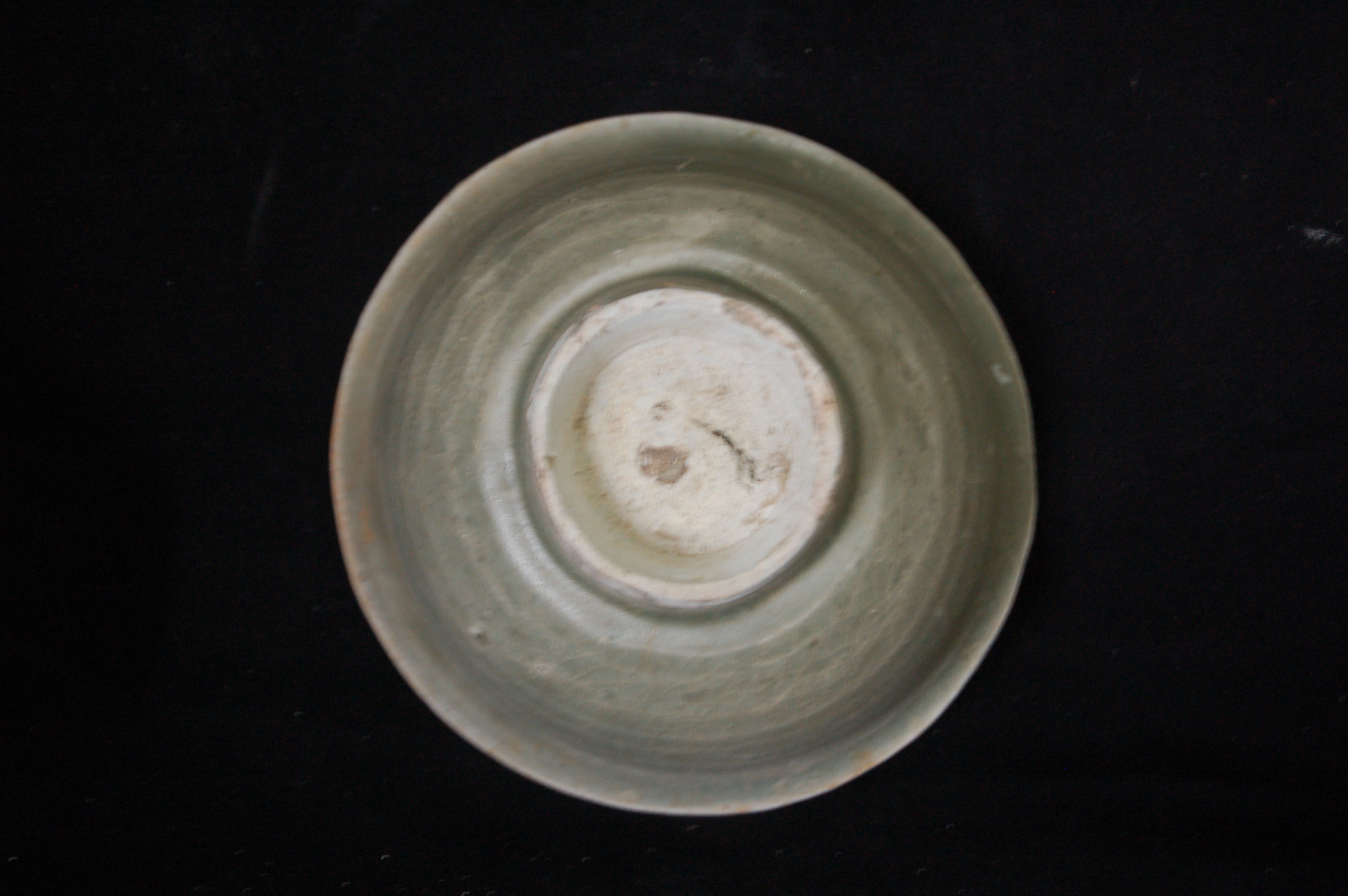Small bowl with everted rim, rounded wall and high carved foot-ring. Diameter 12 cm, height 6.5 cm.