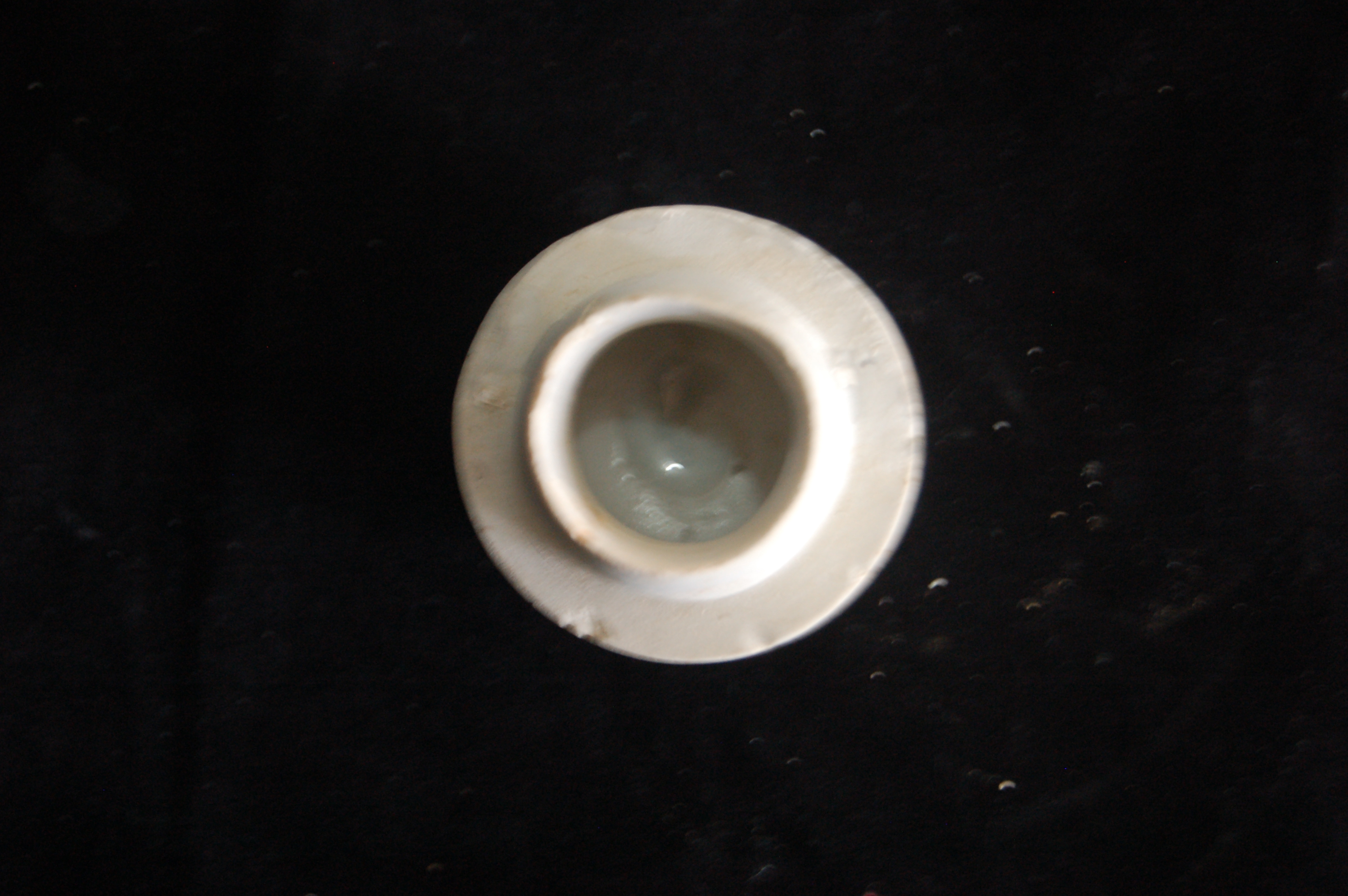 Small covered box base, cylindrical with a tapered flat base. Diameter 5 cm, height 4.5 cm.
